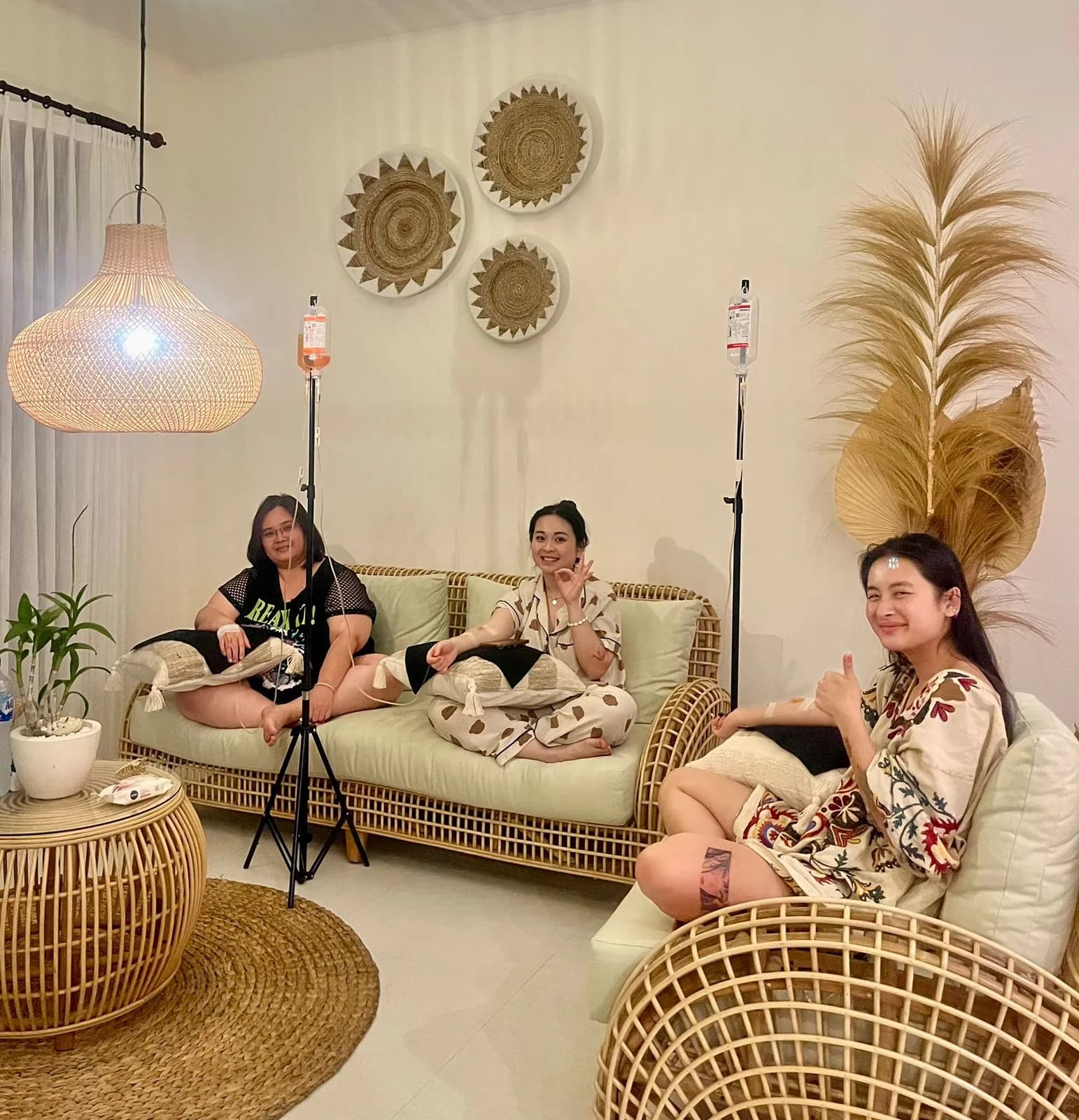 three girls smiling having iv drips