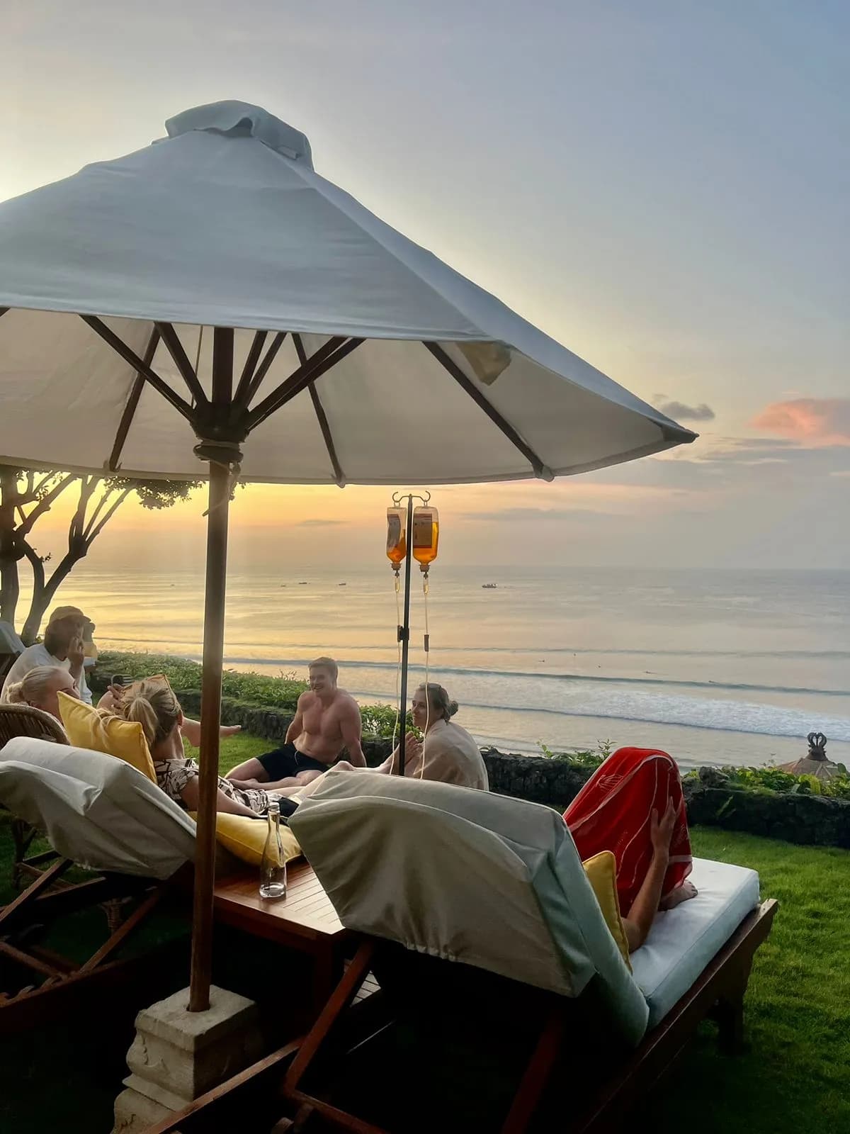 a family having iv drips by the beach side
